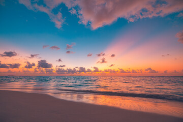 Closeup sea sand beach. Peaceful beach landscape. Inspire tropical beachfront seascape horizon. Orange purple golden sunset sky calmness tranquil relaxing sunlight summer mood. Vacation travel coast - obrazy, fototapety, plakaty