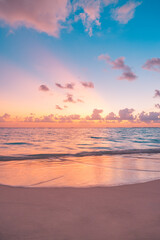 Closeup sea sand beach. Peaceful beach landscape. Inspire tropical beachfront seascape horizon. Orange purple golden sunset sky calmness tranquil relaxing sunlight summer mood. Vacation travel coast