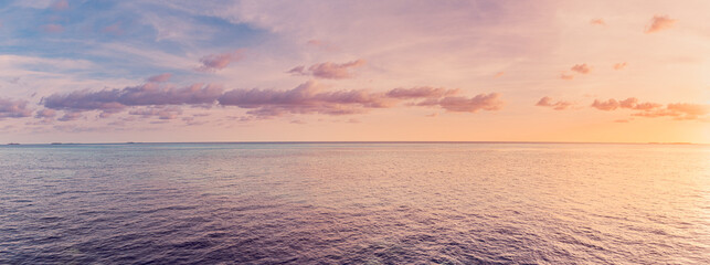 Panoramic sea skyline beach. Amazing sunrise beach landscape. Panorama of tropical beach seascape...