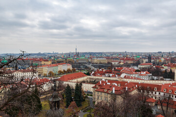 Panoramic view of the medieval city Prague during winter. You can see the tv tower, the Charles bridge, the Prague bridge and the Church of our lady from the distance. The wather was cloudy