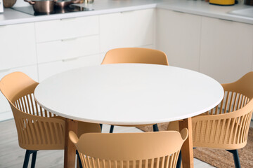 Clean white table in interior of modern kitchen