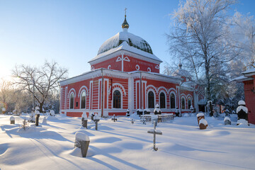 Fototapeta na wymiar Church of St. George the Victorious (1790-1808) at the old city cemetery on a sunny January day. Rybinsk, Russia