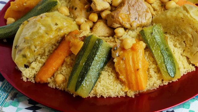 Traditional Moroccan couscous with meat and vegetables, cabbage, carrots, zucchini