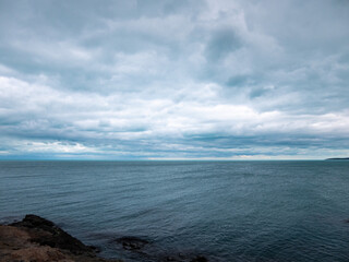 Landscape with sea and cloudy dramatic sky