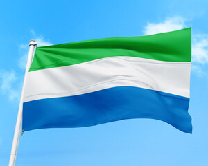 Fototapeta premium Sierra Leone flag fluttering in the wind on sky.
