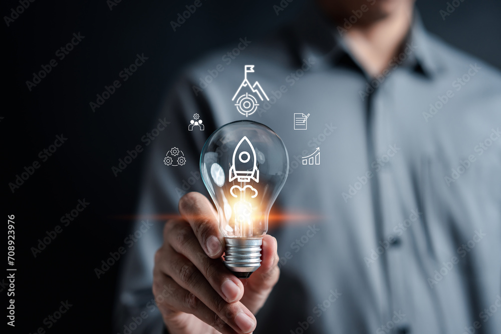 Leinwandbilder Rocket launch idea inside lightbulb. strategically planning and initiating a corporate startup. aim to achieve objectives through value development, fostering leadership.