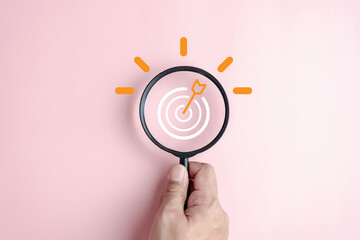 Magnifier glass focus to target objective with idea creative light bulb icon. planning development...