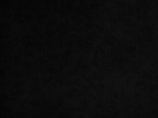 Patterned black faux leather background used for graphic design.