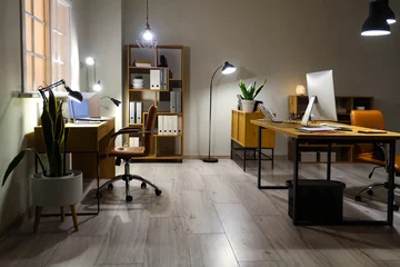 Poster Interior of modern office with desks and glowing lamps © Pixel-Shot