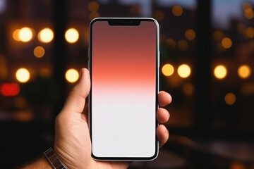 Male hand holds a smartphone with a white screen on the background of the night city