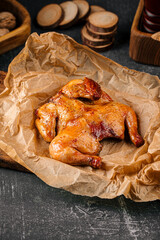 Roast tobacco gherkin chicken on a wooden board