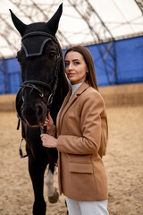 Obraz premium Lifestyle female model outdoors with animal. Beautiful lady with horse portrait.