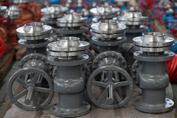 Warehouse of products from large water pipes and gas taps at a metal structures factory