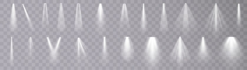 Set of isolated spotlight light effects. White glowing spotlight on a transparent background.