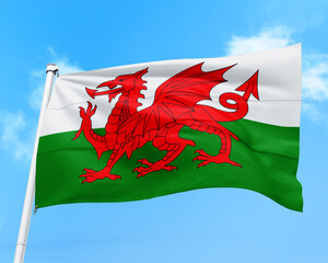 Wales flag fluttering in the wind on sky.