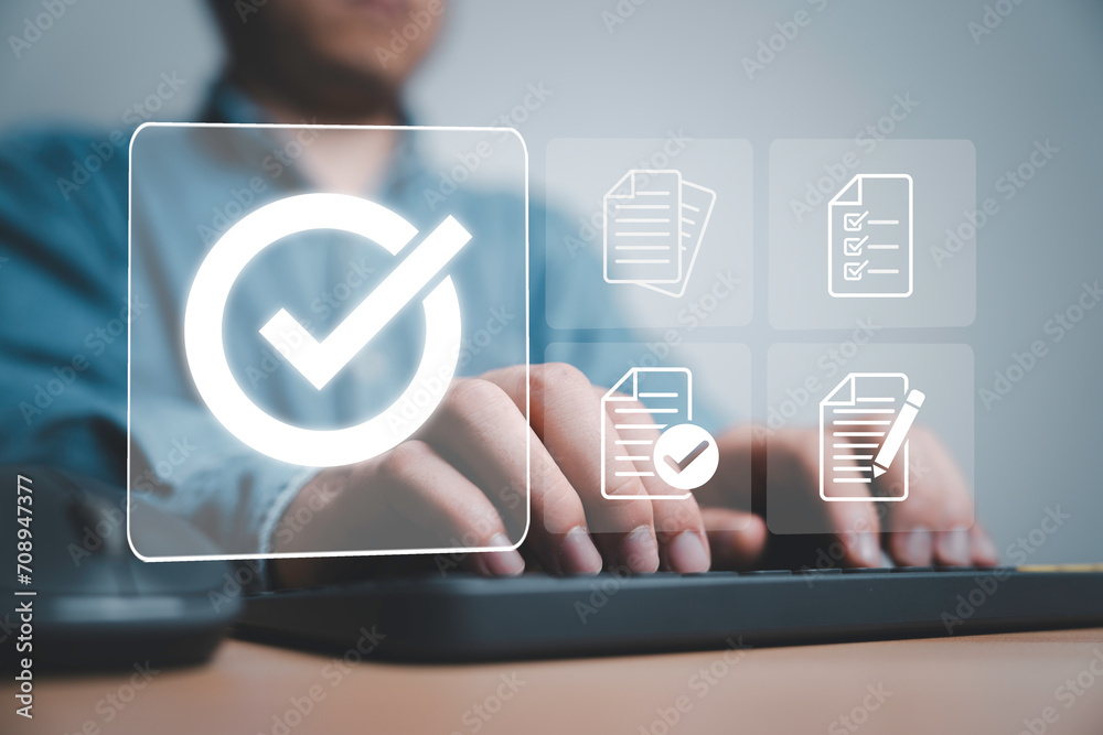 Aufkleber Businessman using laptop computer with correct sign and document icon for approve ISO which related quality control and continuous improvement concept.