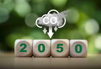 2050 with CO2 reducing icon on greenery background for decrease CO2 emission, carbon footprint and...