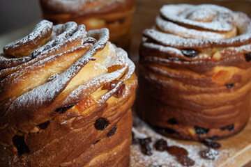 Happy easter. Traditional Easter cake , homemade kraffin with raisins,candied fruits. Selective focus. Close up of homemade Cruffin.