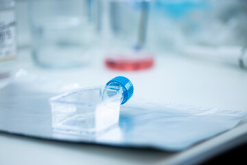 geneticist working with microplate for cells analysis in the genetic lab. Researcher working with...