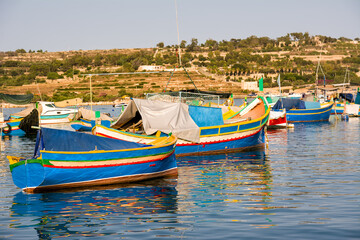 Fototapeta na wymiar Luzzi, typical Maltese boats moored in the harbour