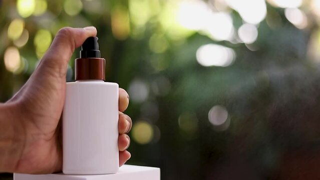 Close-up of a hand-operated spray nozzle. Clean using spray solution. Cleaning, protection concept, antivirus, bactericidal spray
