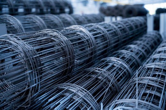 A rolls of wire mesh in the showroom of a large store.