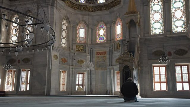 Muslim Man Salah salat Pray inside Nuruosmaniye Camii Mosque Architecturally significant Ottoman mosque Istanbul, Turkey