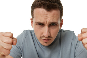 Fototapeta premium angry guy looking at camera on white studio background