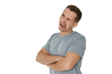 Obraz premium young man shows her toung, feels disgust on white background.