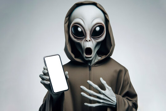 Shocked real Mysterious alien holding smartphone with white mockup screen on solid white background. ai generative