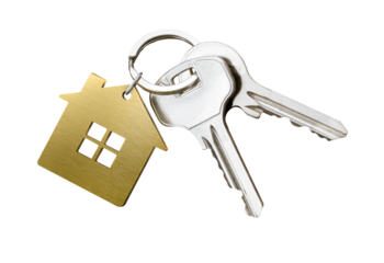 House keys with golden house shaped keychain isolated on white background