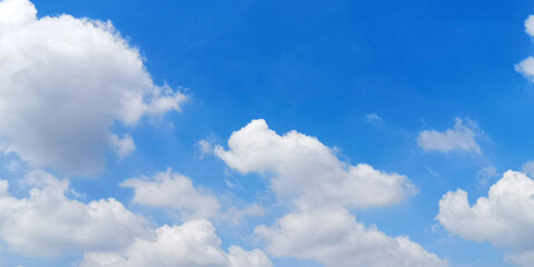Naklejka na ściany i meble The vivid blue sky and the fluffy white cloud. Blue sky and cloud background.