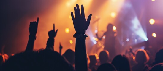 Fototapeta premium Raised hand at Christian music concert.