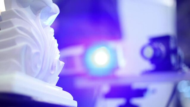 Close up of working 3D-scanner reading data of rotating object
