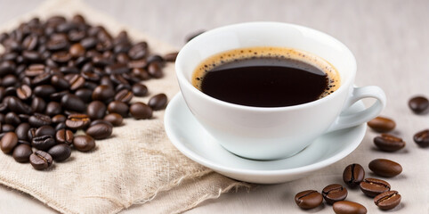 Fototapeta premium serving a cup of coffee and a bag of coffee beans on the table 2