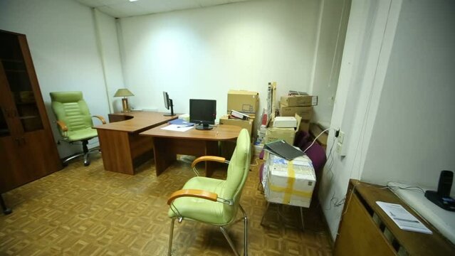 Office room with working places, packs of papers and documents
