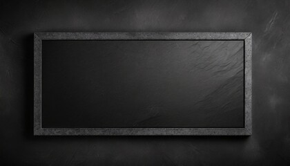 black on black empty black granite stone rectangle board on black textured cement background top view vith copy space for your text
