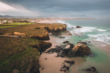 Aerial view of one of the most beautiful beaches in Galicia. The power of water created sea caves and stone arches on this beach (Playa de las Catedrales, Lugo)
