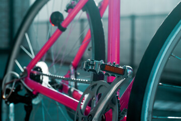 Pink bicycle metal pedal close up and focused. 