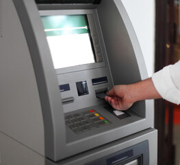 Man using banking machine