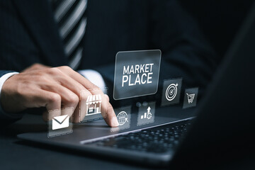 Marketplace concept. Businessman use laptop with marketplace icon for online business web technology. Online marketplace e-commerce internet shopping business..