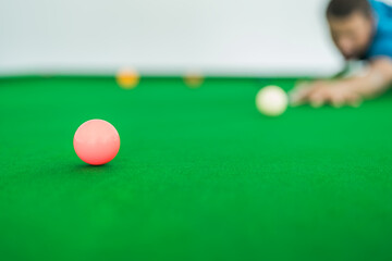 person playing snooker