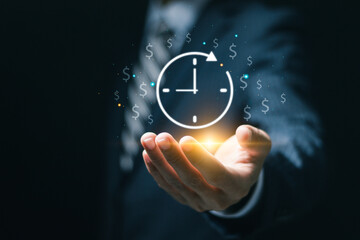 Time is money concept. Businessman holding virtual icon of clock and money for business time management. Work planning increases efficiency and reduces work time. - obrazy, fototapety, plakaty