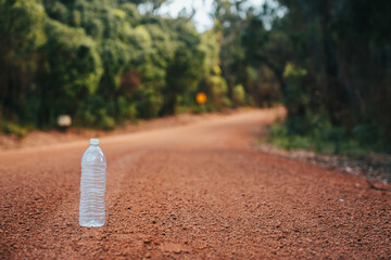 Plastic bottle in Australian forest , red colour land and empty water bottle 