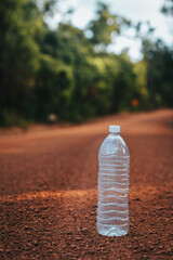 Plastic bottle in an Australian forest , red colour land and empty water bottle 