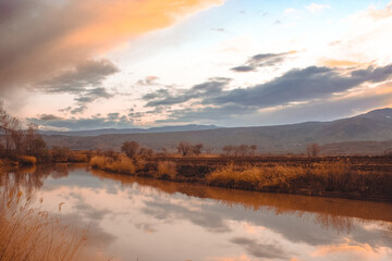 Fototapeta premium Anatolian Elegance: Serene River at Dusk and Twilight