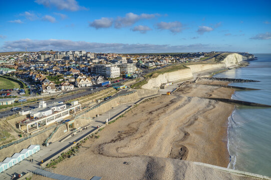 Aerial view of the White Chalk Cliffs at Saltdean in East Sussex heading west towards Peacehaven along the undercliff walk.