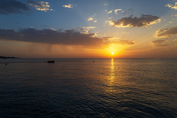 Landscape by the sea in Greece on the island of Rhodes. Sunrise, dramatic clouds. Beautiful background.