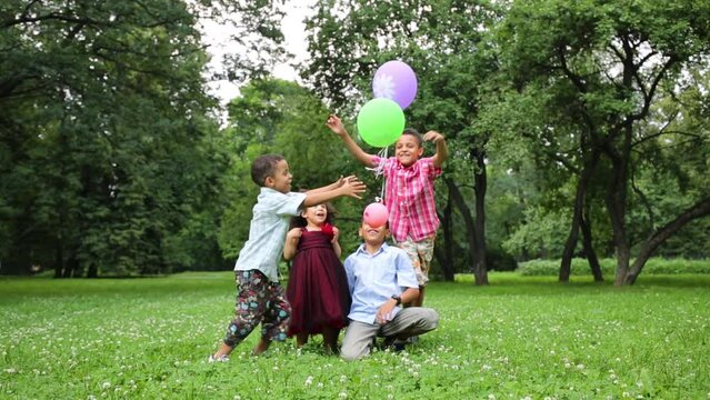 Children playing with balloons and release it into the air