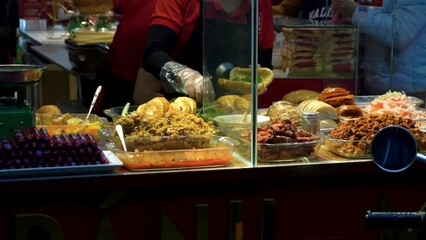 Showcase of a Thai street restaurant with traditional Thai a la carte menu, Street food, Raw meat with vegetables showcase of restaurant.
